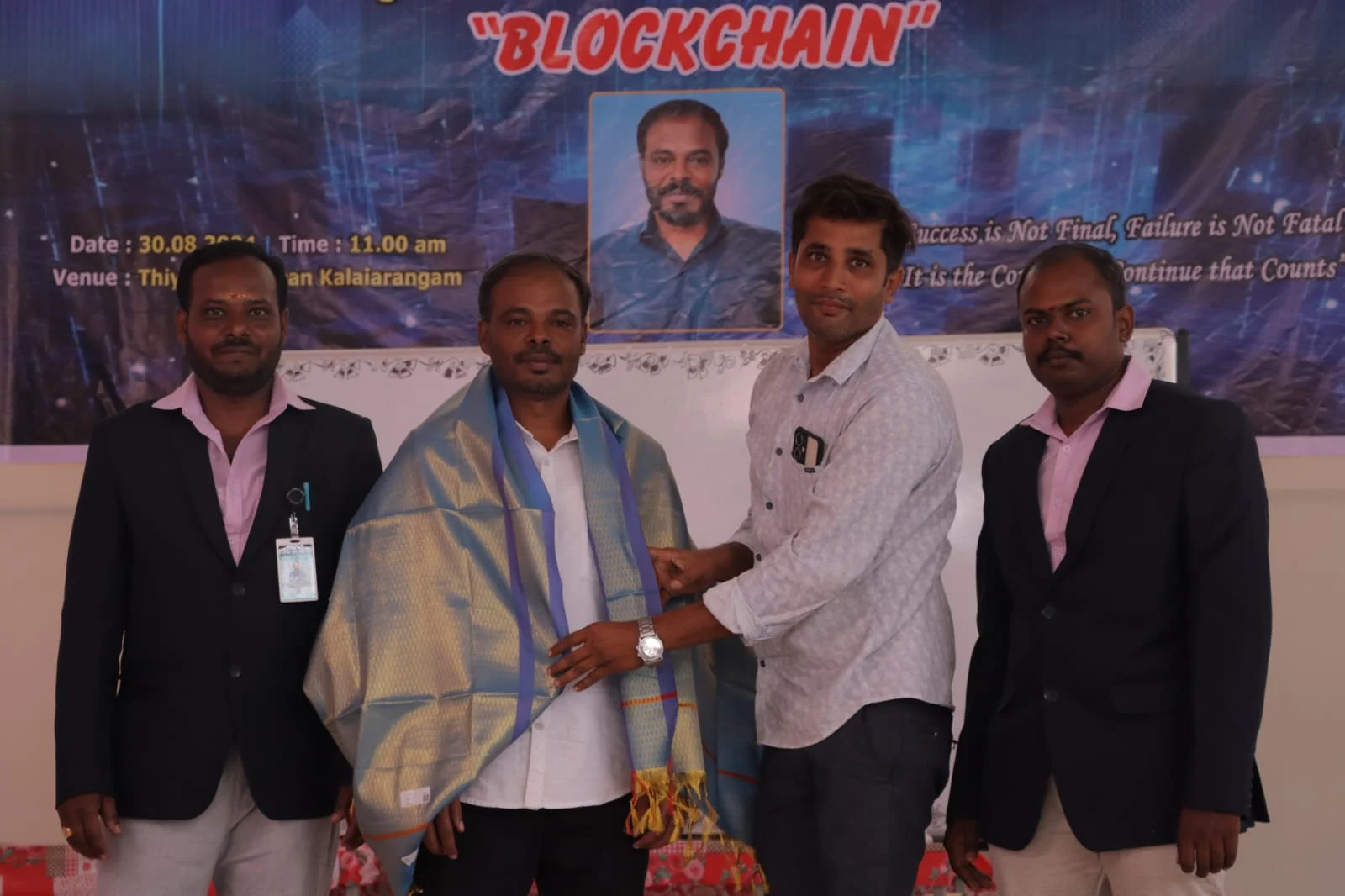 RootAxis Founder felicitated with traditional golden shawl at Blockchain seminar