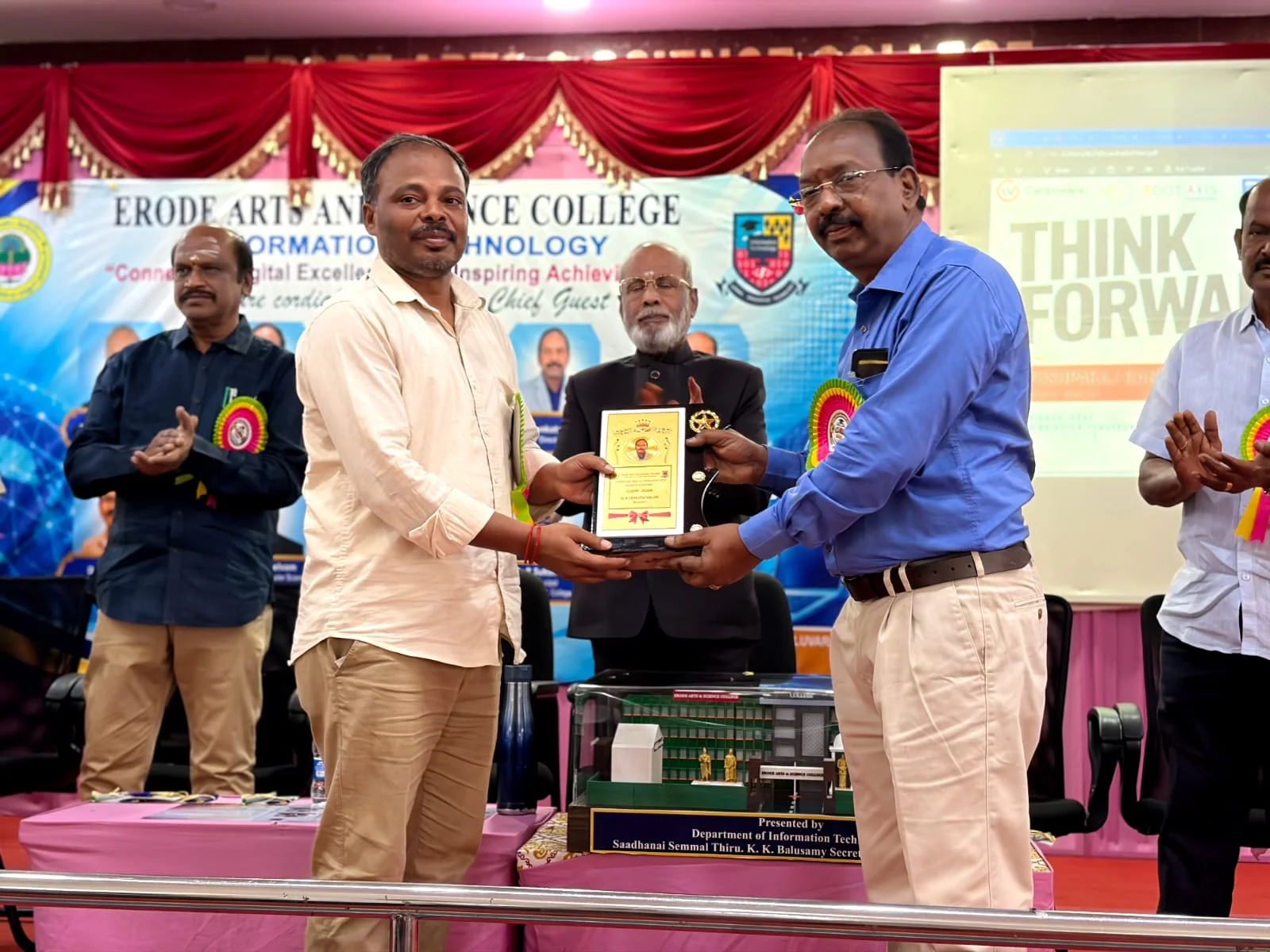 RootAxis Founder receiving honor memento at Erode Arts and Science College IT Department
